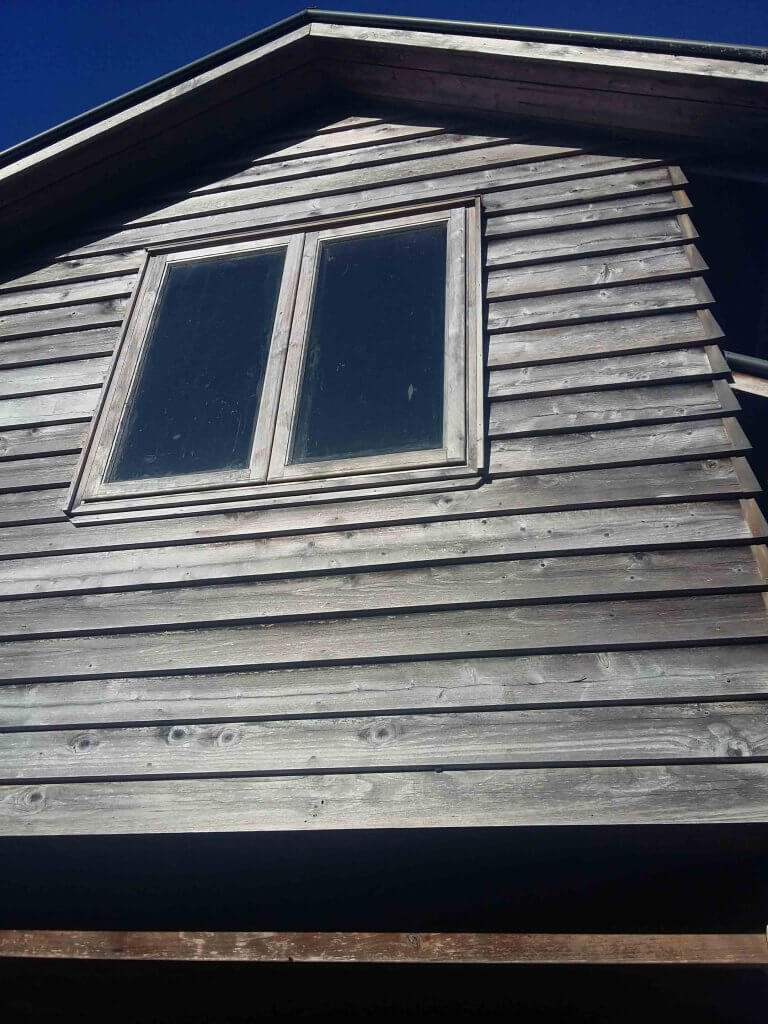 picture of walls which shows cedar cladding before the wash process.